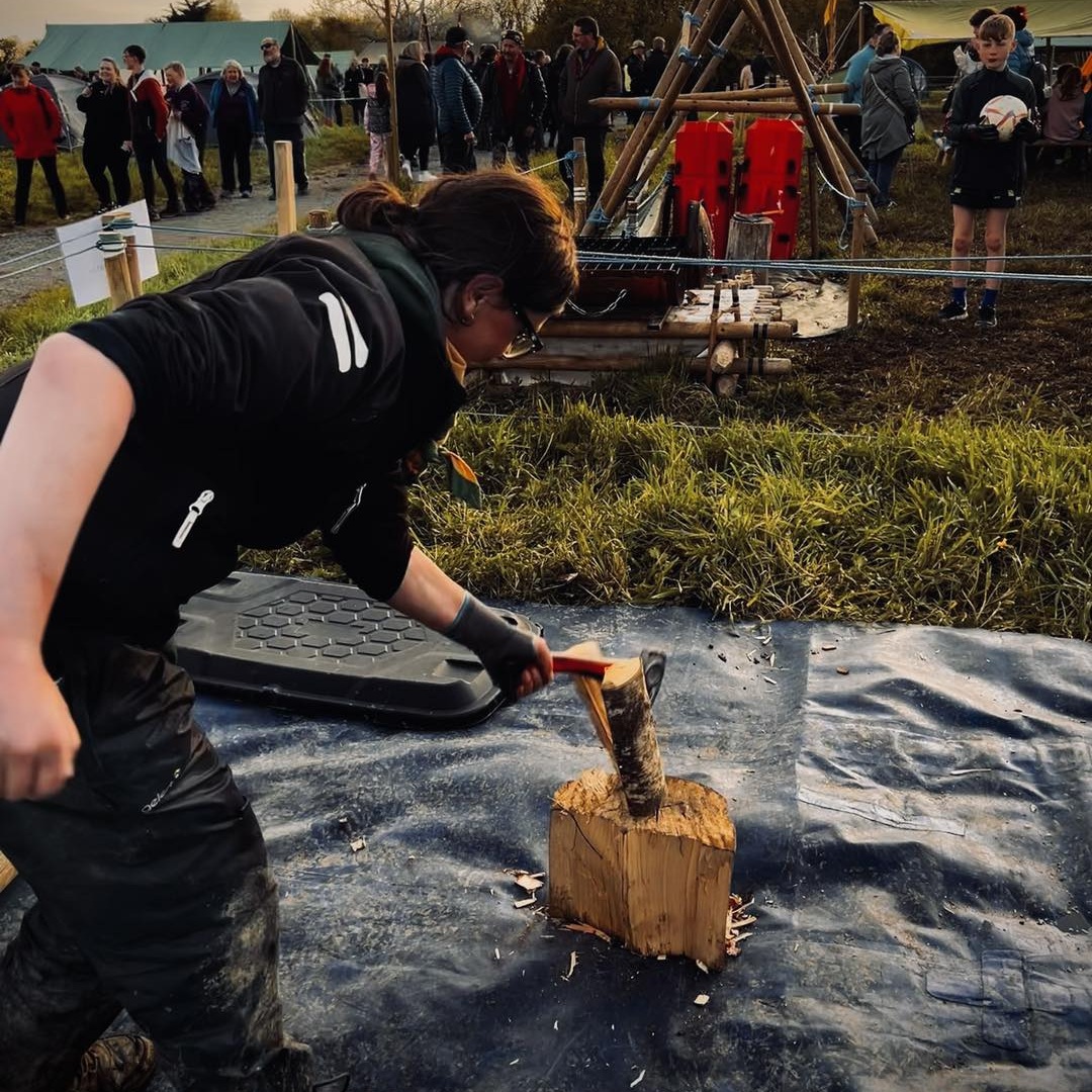 Venture Scout chopping wood